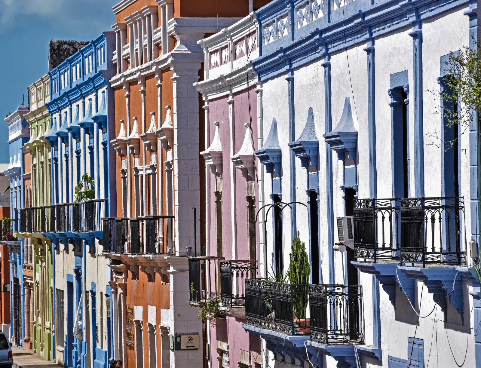 Iron balconies and coloured facades on Calle 10 in Campeche's historic centre